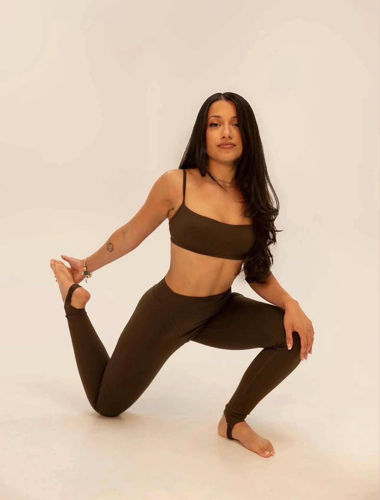 Denise demonstrating pilates movement